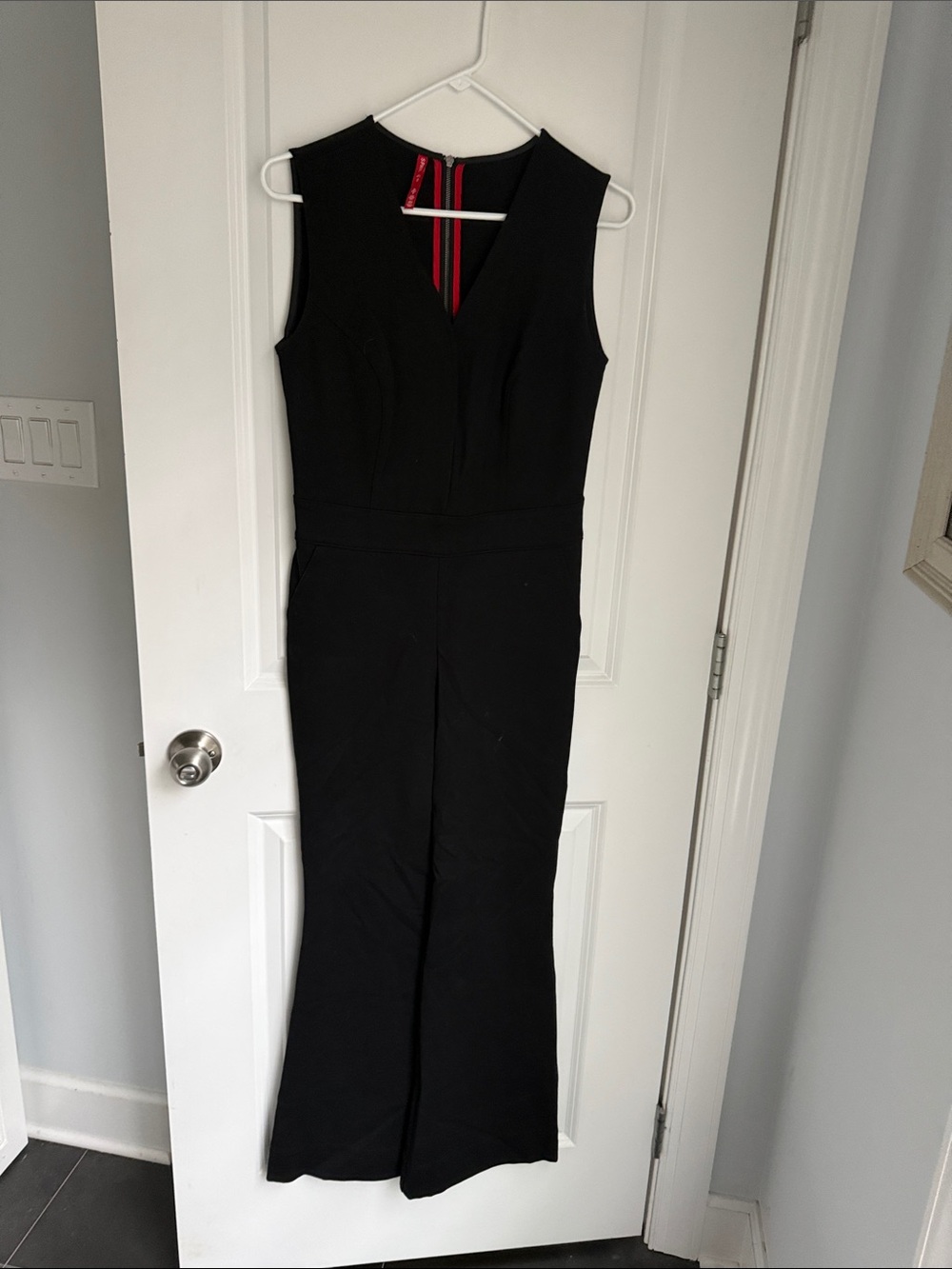 SPANX Black Sleeveless Boot-Cut Jumpsuit with Red Zip Detail
